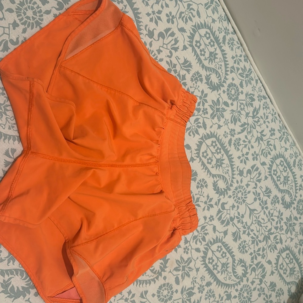 lululemon neon orange shorts